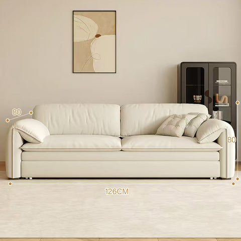 Cream-colored leather wilson single seater with clean lines and tufted cushions two seater sofa bed with storage
