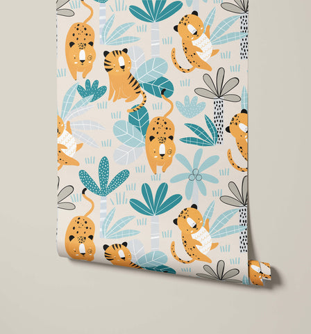 A roll of wimba jungle-themed wallpaper with cartoon cheetahs and tigers in orange teal and gray on cream background
