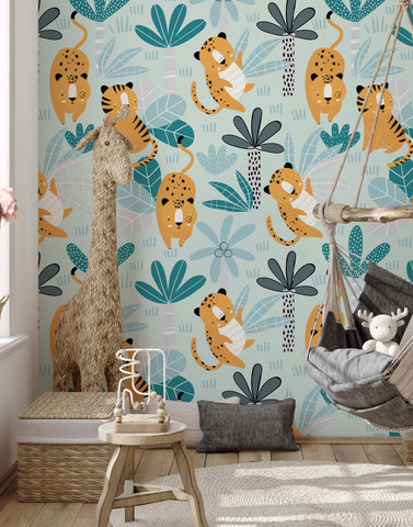 Wimba whimsical jungle wallpaper with playful orange and black cheetahs green palm trees and teal leaves on blue background
