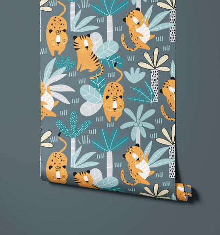 A roll of wimba illustrated wallpaper with cartoon orange black and white cheetahs and tigers on teal gray jungle background