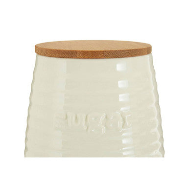 Cream dolomite sugar canister with natural wood lid and embossed bee pattern for stylish kitchen storage