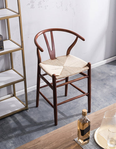 Classic wooden wishbone bar stool black ash with woven beige seat perfect for stylish bar seating