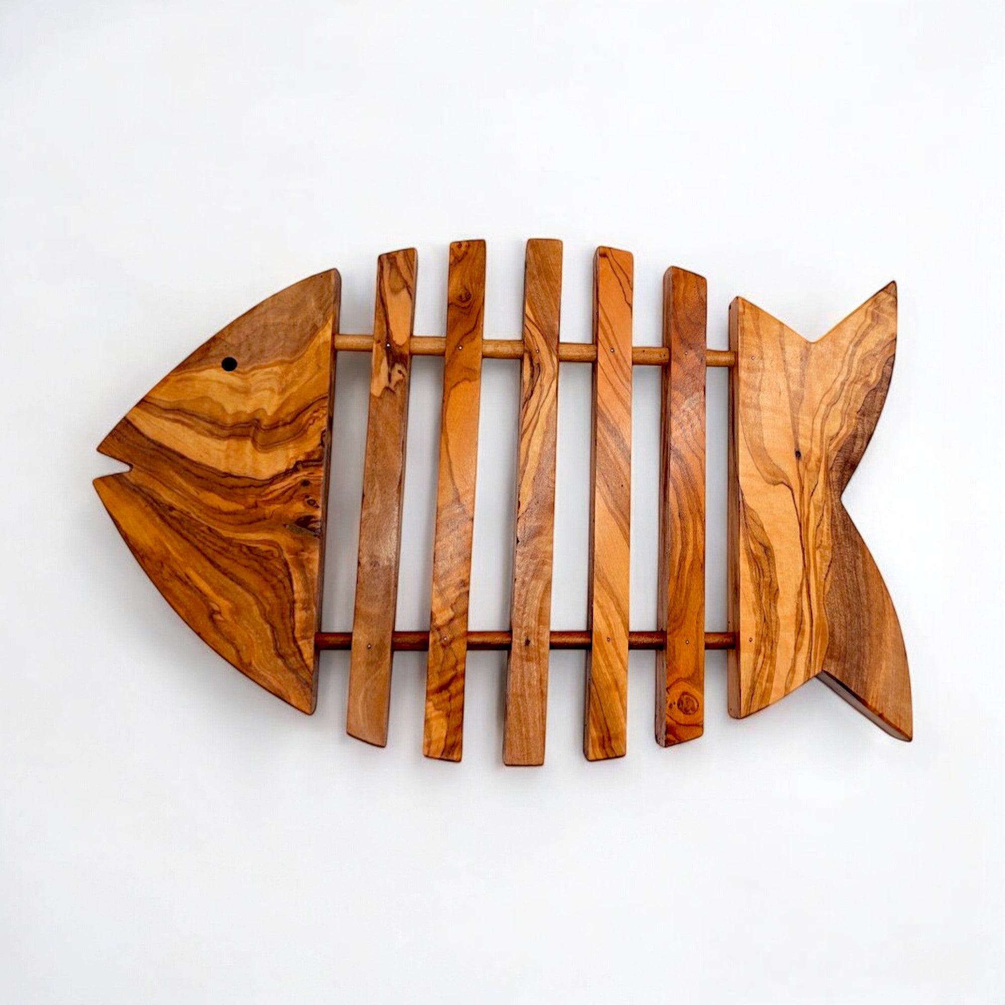 Rustic olive wood fish shaped pan coaster with natural grain and slatted design perfect as kitchen trivet gift