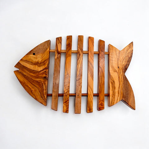 Rustic olive wood fish shaped pan coaster with natural grain and slatted design perfect as kitchen trivet gift