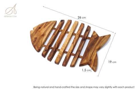 Handcrafted olive wood fish shaped pan coaster with natural grain and vertical slats for kitchen use and heat resistance