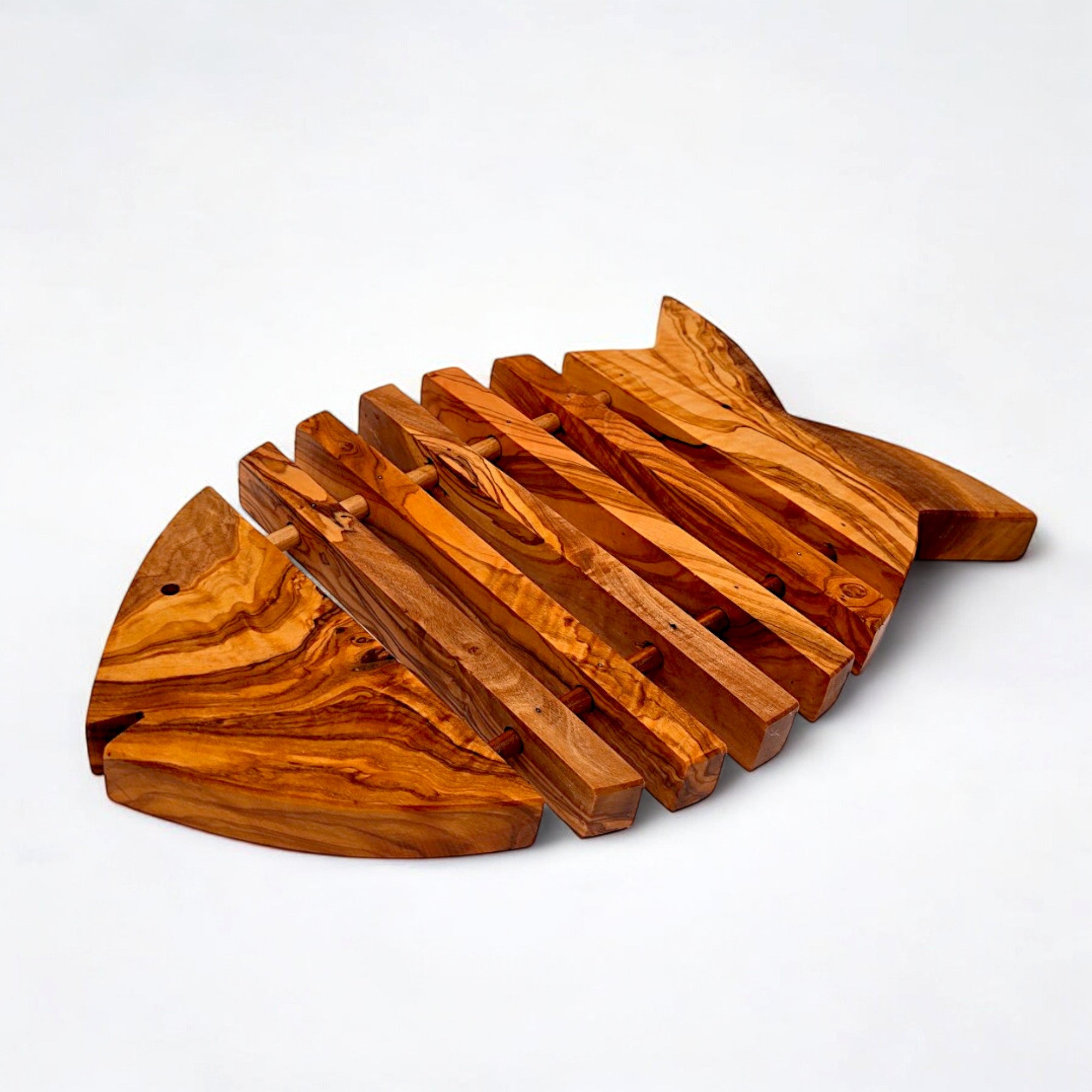 Rustic olive wood fish shaped pan coaster with natural grain and slatted design perfect for kitchen accessories