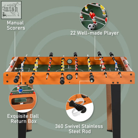 Wooden soccer football table with green surface black steel rods and red and yellow players for arcade game room bar