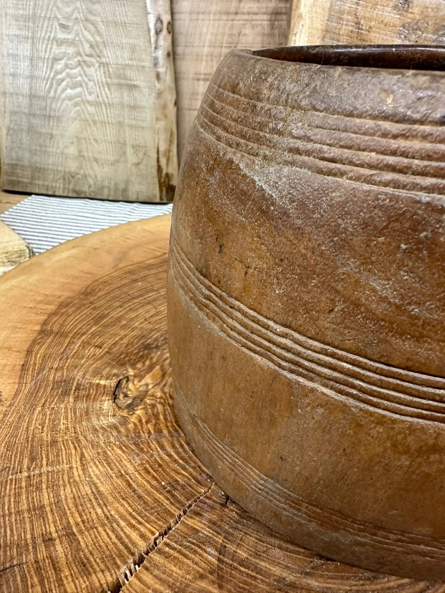 Rustic hand carved wooden vintage herb plant pot planter with concentric grooves in warm weathered brown finish