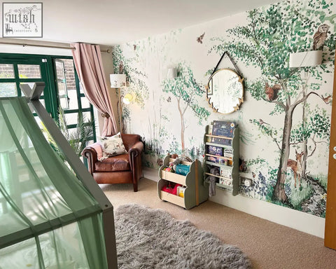A cozy brown leather armchair with patterned cushion near window complements woodland animals mural wallpaper by artist katie 180gsm non-woven