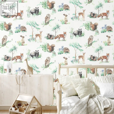 Woodland animals childrens wallpaper with 52cm pattern of foxes squirrels owls and deer in soft greens and browns