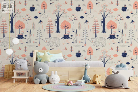 A cozy kids bedroom with woodland animals kids wallpaper in blush pink navy blue traditional paper mural