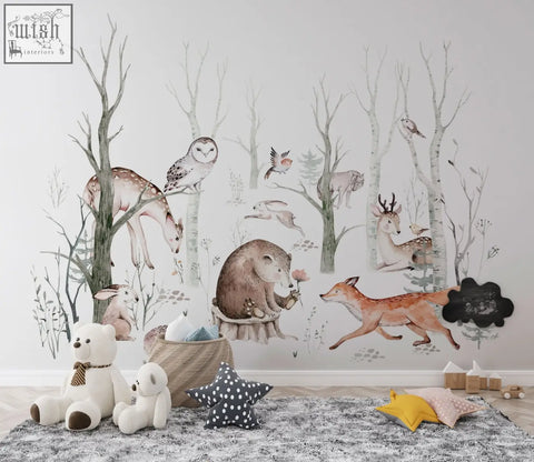 Whimsical woodland forest wall decals with hand-painted deer owls foxes and rabbits in soft earthy tones on gray wall