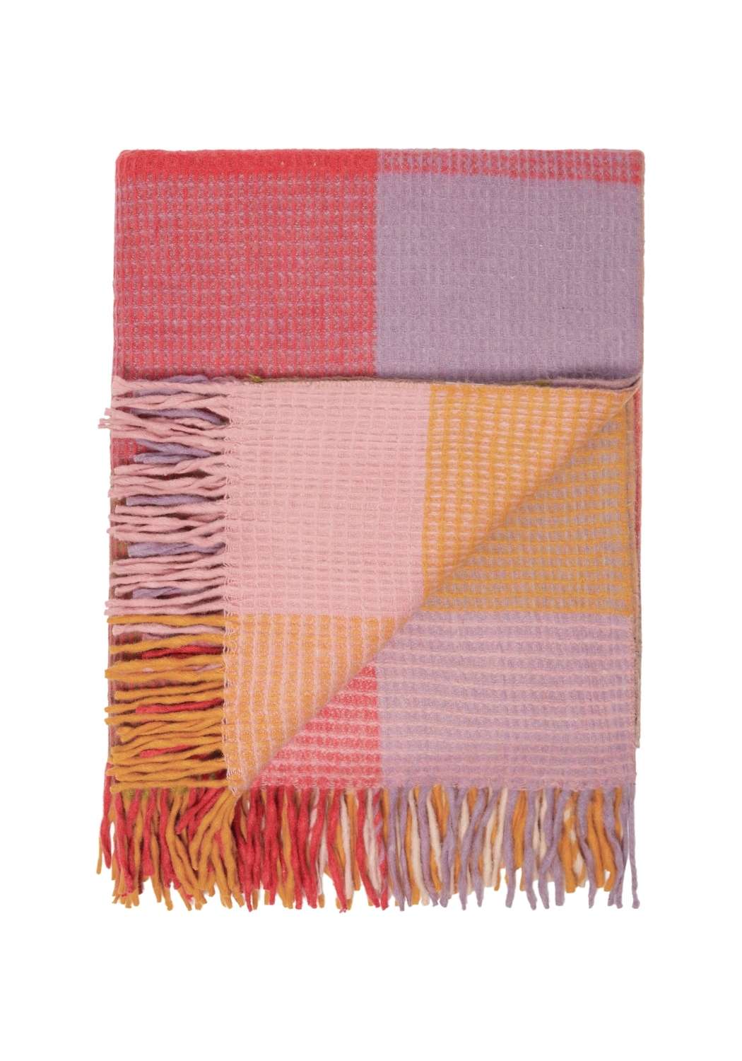 A soft woven wool waffle blanket in orange pink check with colorful patchwork and fringed edges for cozy use