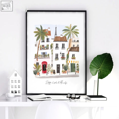 A framed wall art print showing a colorful parisian street with palm trees and the eiffel tower for work office wall