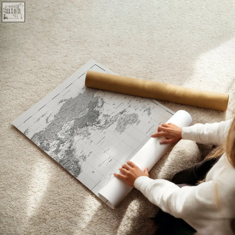 A set of 2 world map prints featuring large detailed grayscale cartography on sturdy paper perfect for wall decor