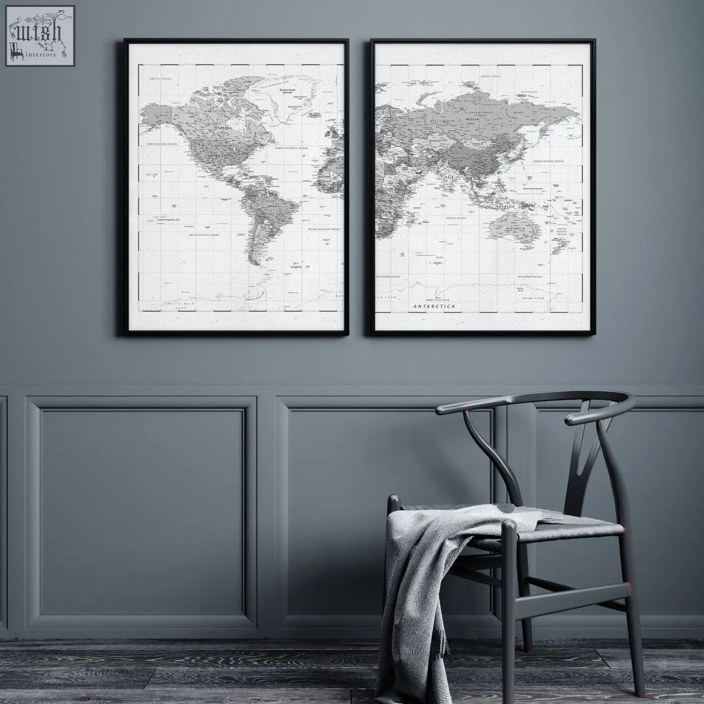 Two minimalist black and white world map prints with detailed cartography hang side by side on a grey wall