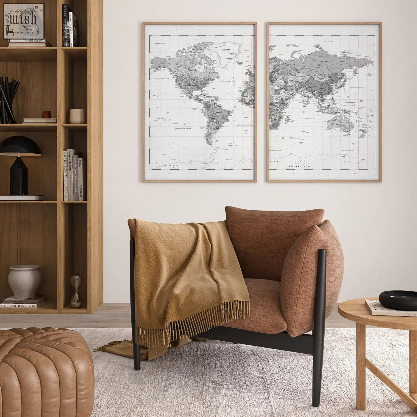 Brown upholstered armchair with black metal legs and tan fringed throw next to grey detailed world map prints diptych set of 2