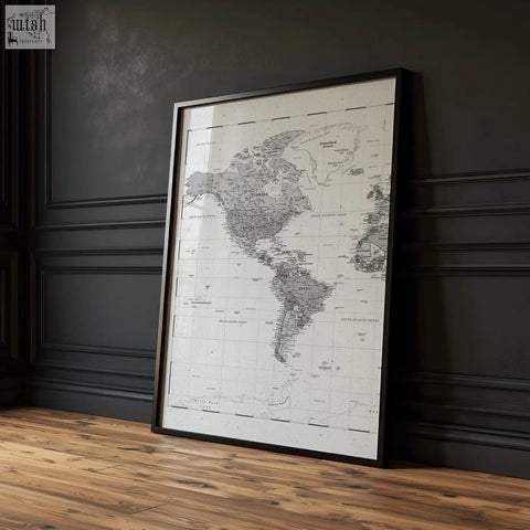 A sleek black framed world map print with minimalist black and white ink on paper in a set of 2 diptych prints