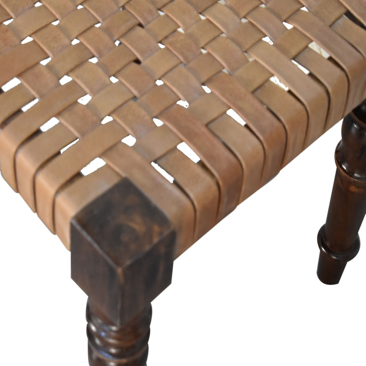 Woven leather footstool with tan leather-wrapped seat and dark legs in chestnut finish solid mango wood