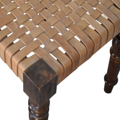 Woven leather footstool with tan leather-wrapped seat and dark legs in chestnut finish solid mango wood