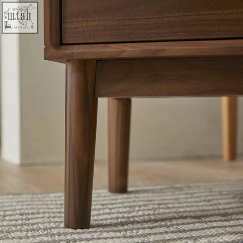 Dark brown wright narrow walnut bedside table with solid walnut wood drawer runners and tapered legs polished finish
