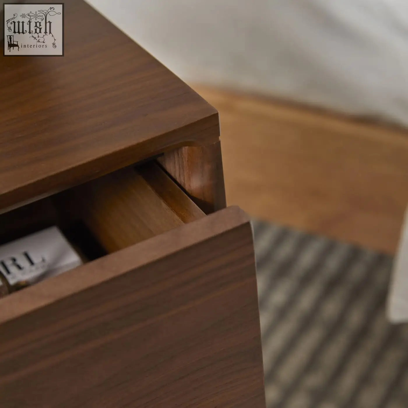 Dark brown wright narrow walnut bedside table with solid walnut wood drawer runners and visible wood grain