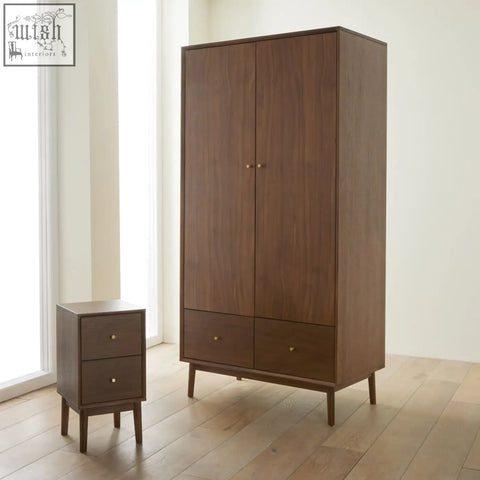 Dark brown solid walnut wardrobe with two doors two drawers wood drawer runners and gold toned knobs minimalist design