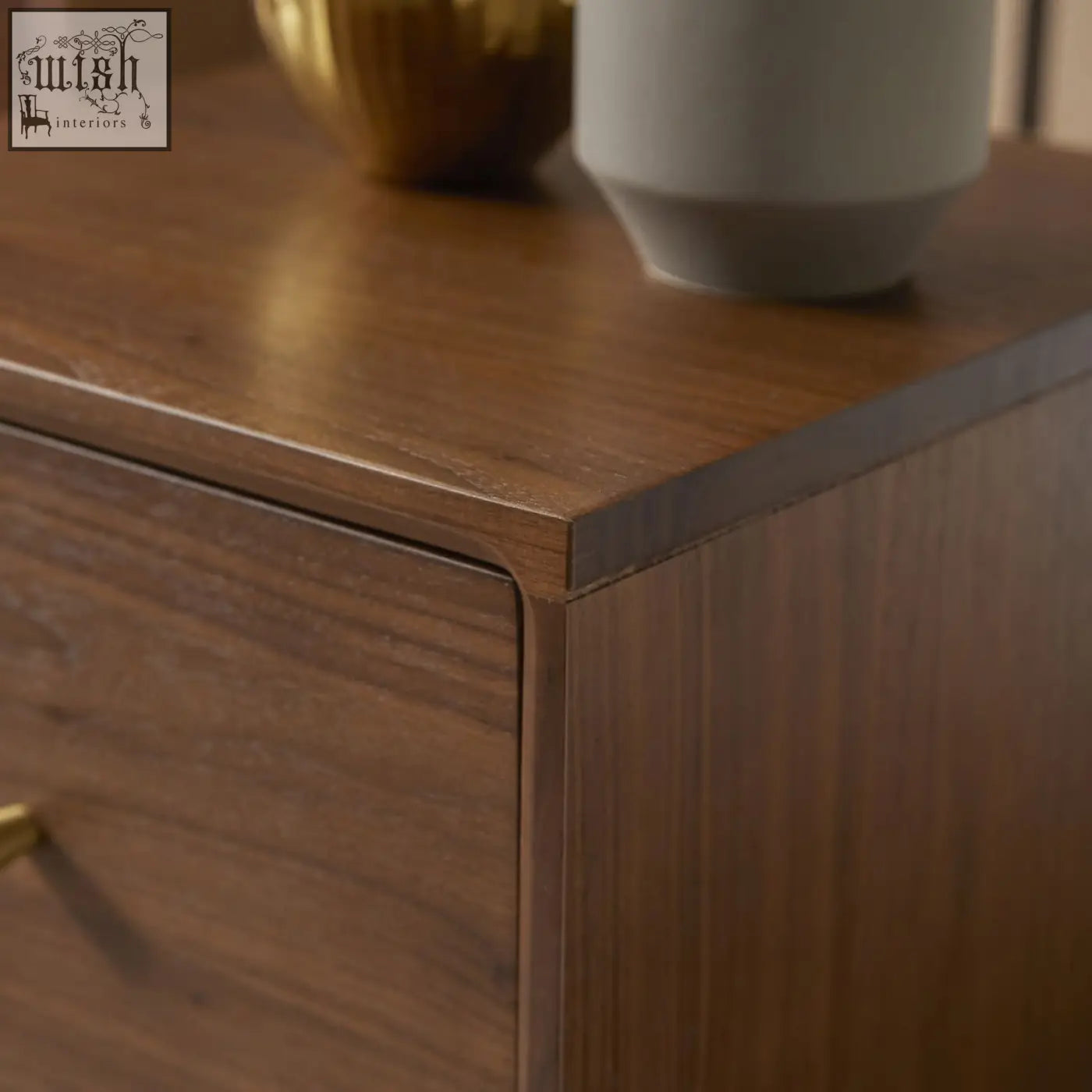 A sleek dark brown wright narrow walnut bedside table with solid walnut wood drawer runners and smooth finish