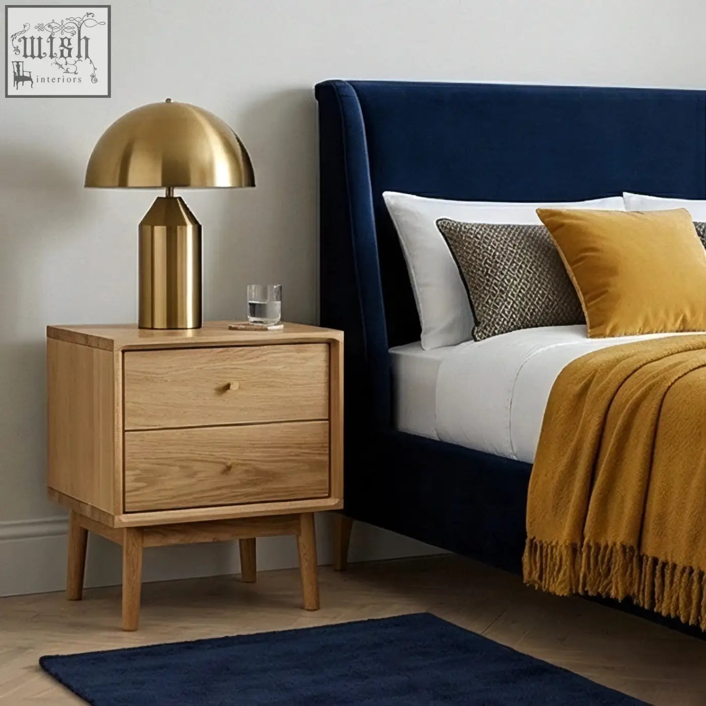 Gold dome lamp with cylindrical base on a solid oak bedside table in light oak finish perfect for bedrooms