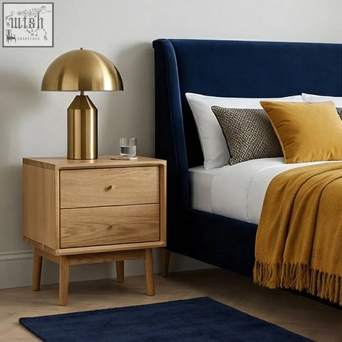 Gold dome lamp with cylindrical base on a solid oak bedside table in light oak finish perfect for bedrooms