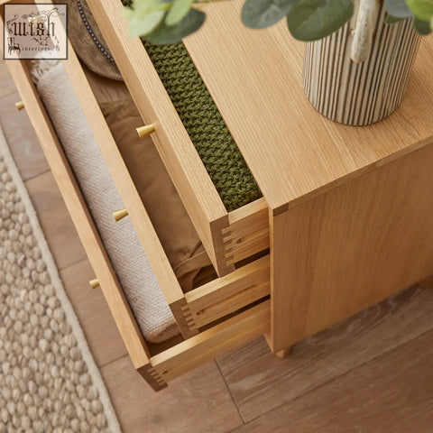 Light wood wright oak chest of 3 drawers with oak veneers open showing woven textiles and striped ceramic vase on top