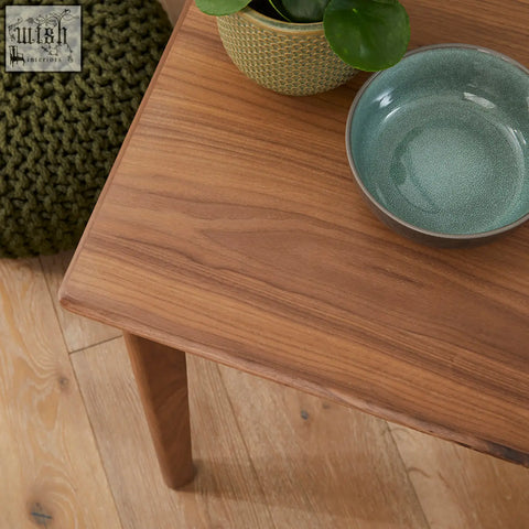 A sleek light brown solid walnut side table with wood drawer runners featured in the wright walnut desk and dressing table with year warranty