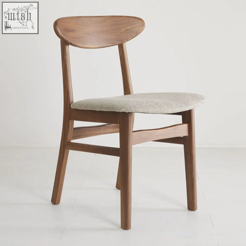 A sleek wright walnut dining chair set of 2 with curved backrest and light gray upholstered seat