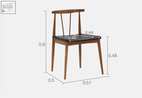 A sleek wooden wyatt dining chair with black upholstered seat and backrest featuring minimalist design lines