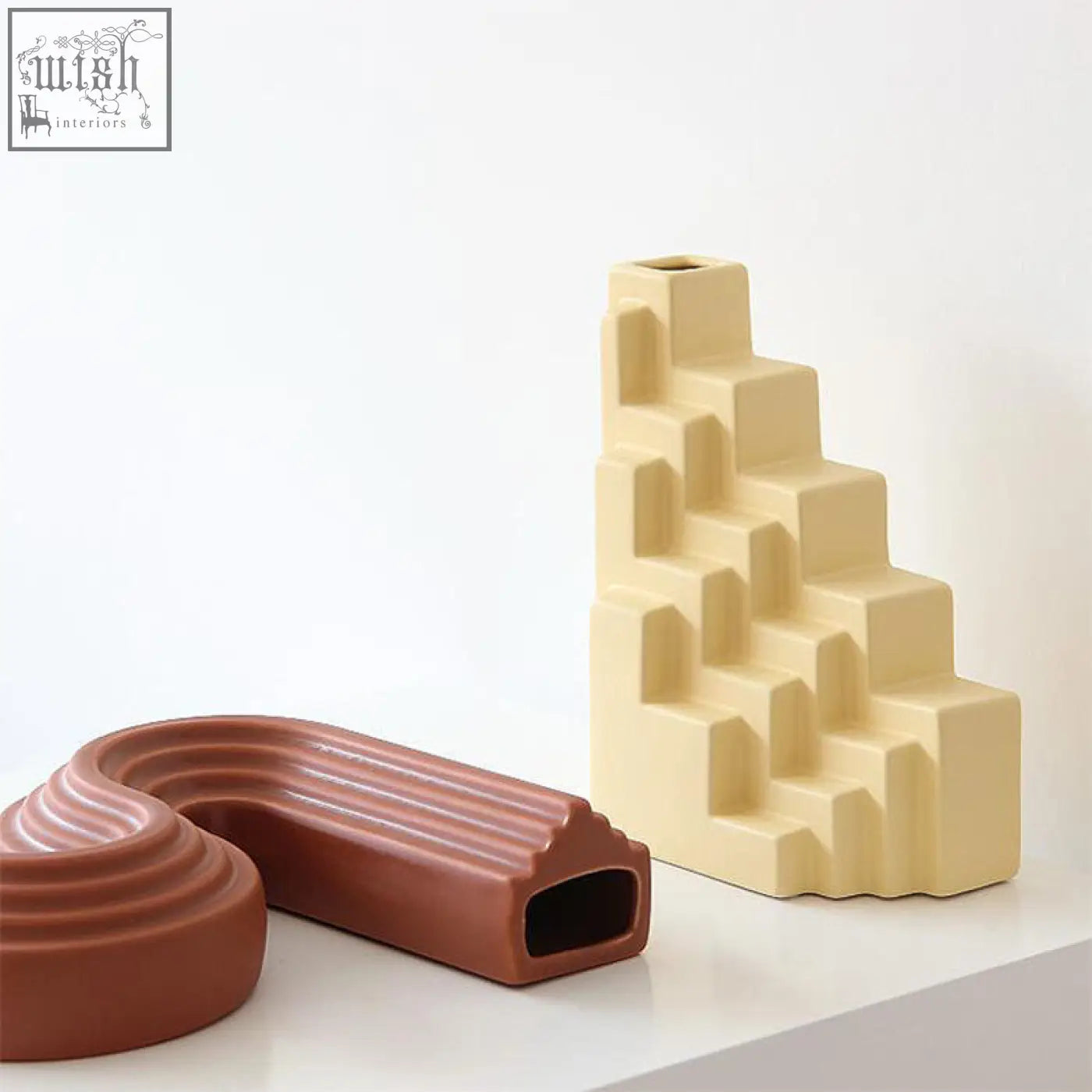 Cream-colored ceramic shaped vase with stepped geometric design from xenia ceramic shaped vase collection