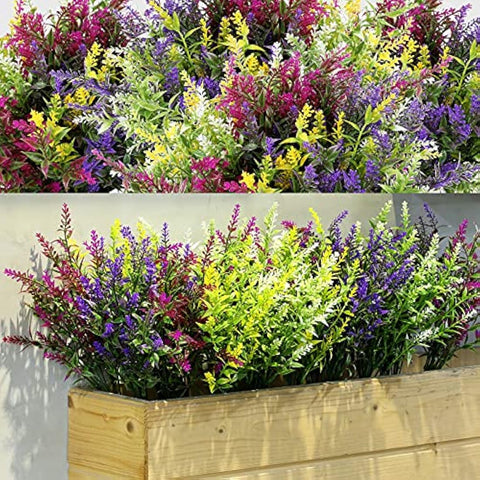 Vibrant purple pink yellow plastic faux flowers in light wood planter perfect for outdoor fake plants and home decor