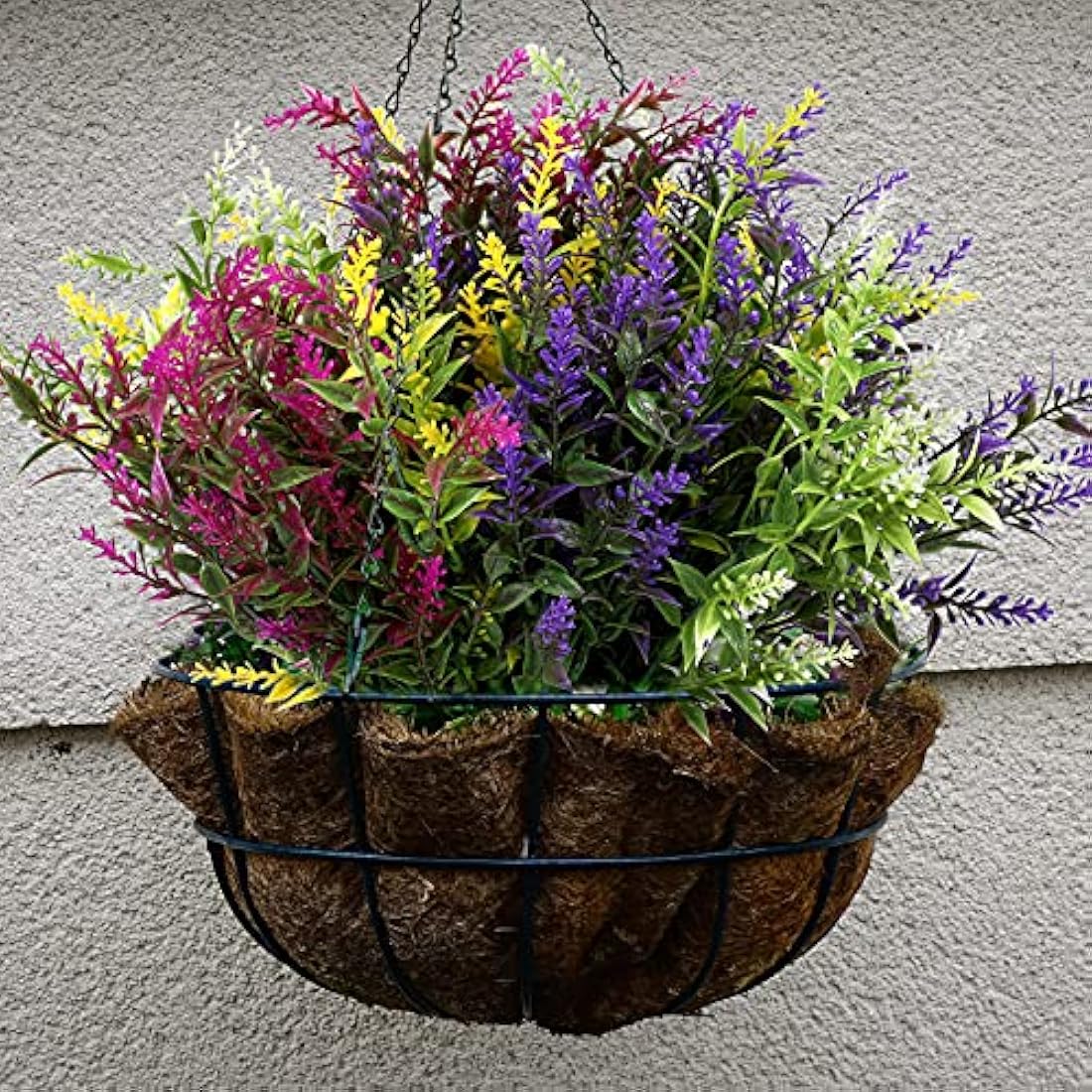 A vibrant hanging basket of xinnun plastic faux flowers in purple pink yellow and green perfect for outdoor fake plants