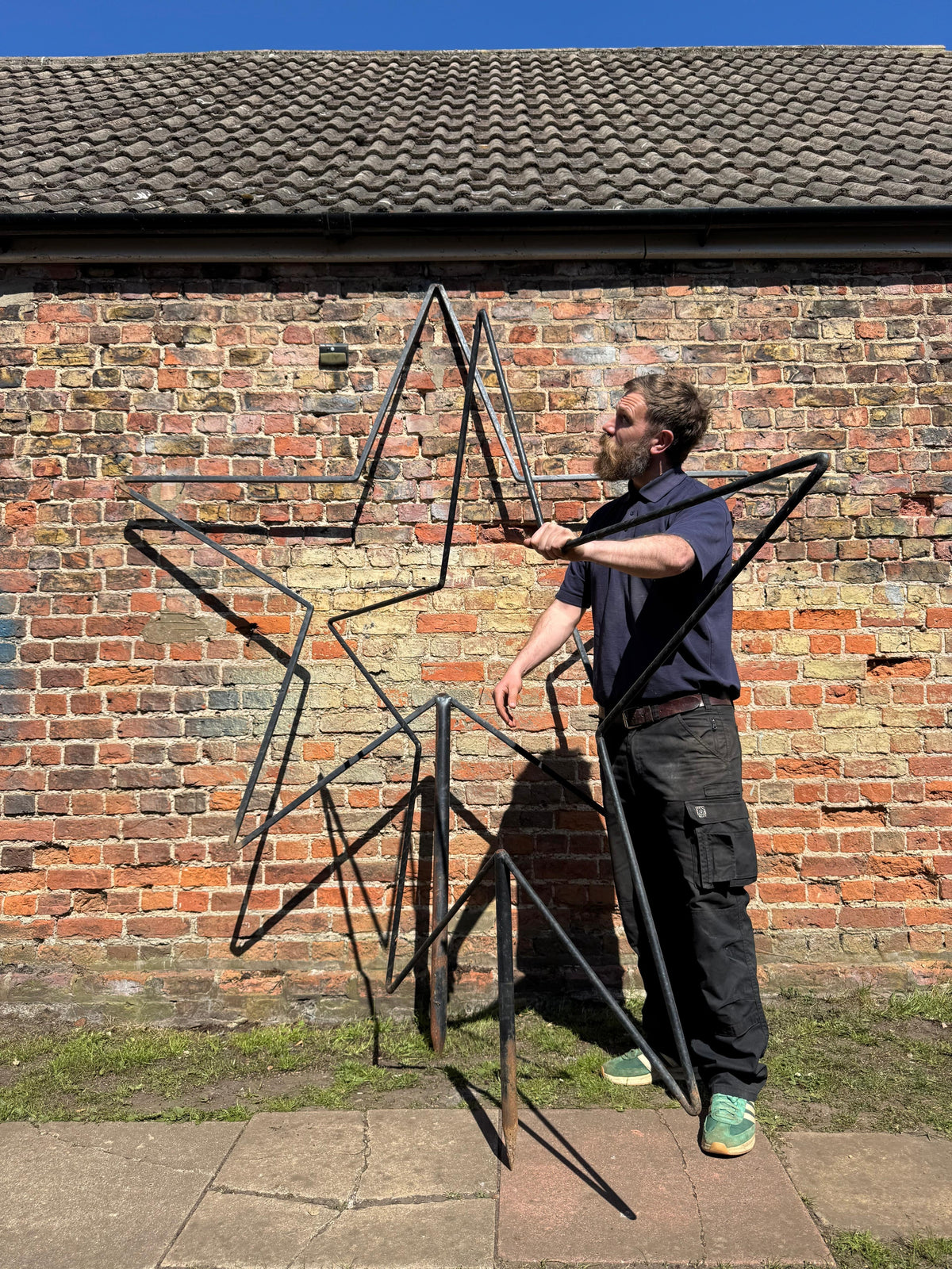 Xl black metal star garden stake sculpture with intersecting triangular frames for christmas and wedding decor