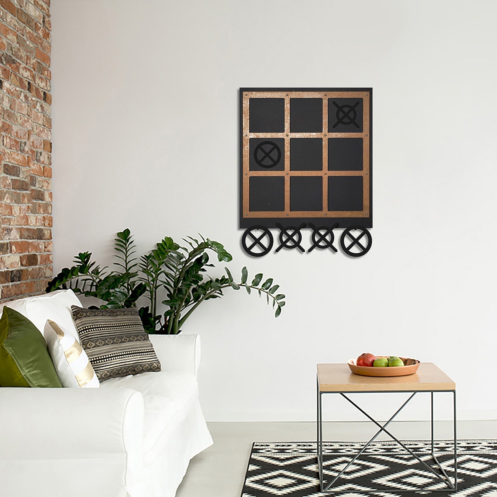Black and copper metal tic tac toe wall art with xs and os arranged in a grid called xox board three in a row