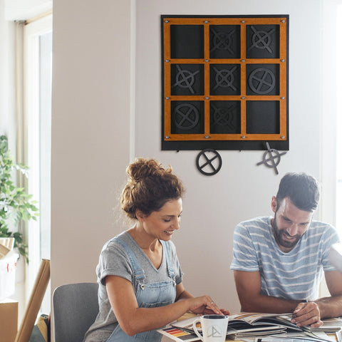 Black and orange tic tac toe wall art with metal xs and os perfect for xox board three in a row game decor