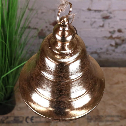 Rustic gold-toned metal yanika hanging bell 20cm with weathered finish and top loop for easy hanging