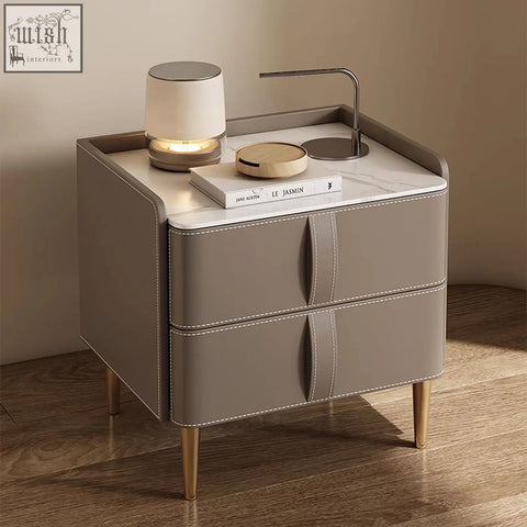 Modern taupe leather yano bedside table with marble top gold tone legs and solid wood brown frame