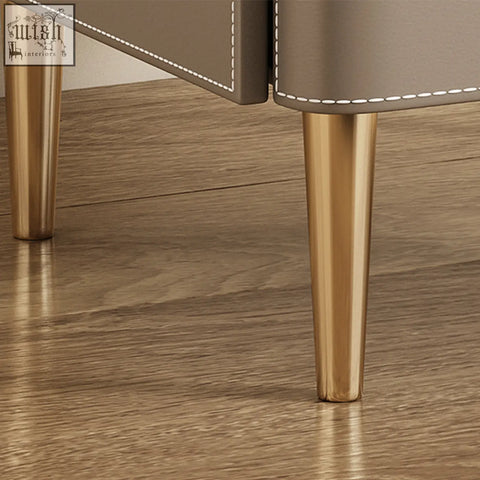 Yano bedside table in solid wood with taupe leather top white stitching and polished brass legs in brown finish