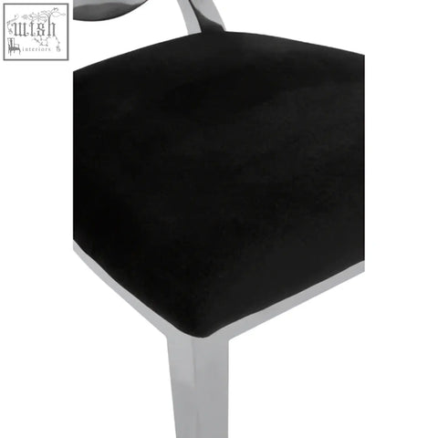 Yasmin oval back black velvet dining chair with chrome legs and cushioned seat perfect for stylish dining rooms