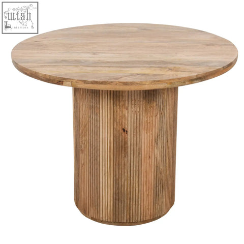York natural solid wood round dining table with light brown finish and vertical slat detailing on base