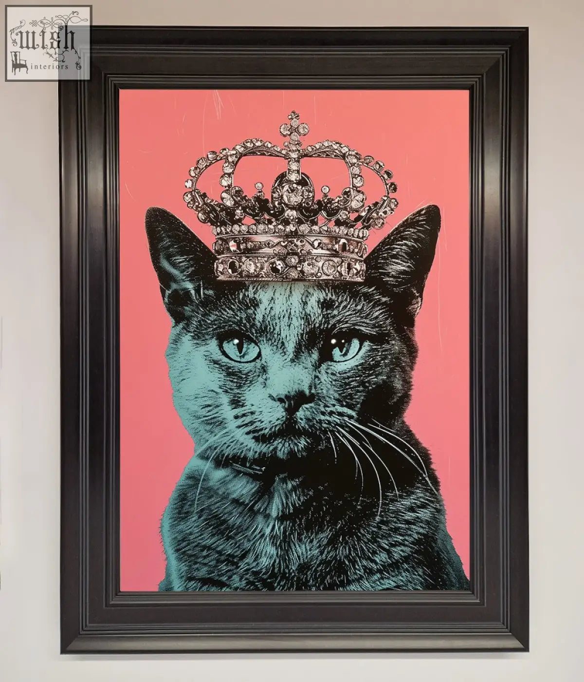 A framed print of a teal majesty cat framed wearing a silver crown on a vibrant pink background cat framed print