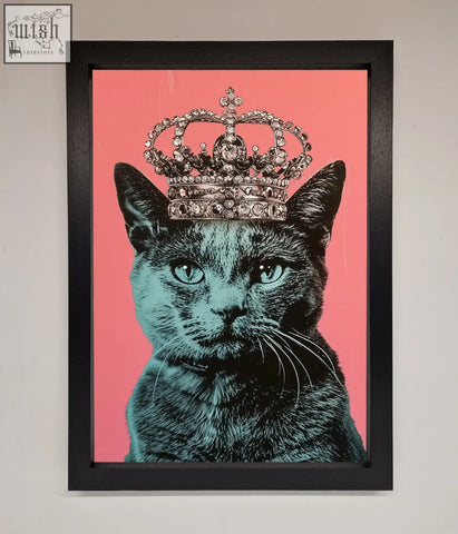 Your majesty cat framed print featuring a black cat with teal eyes and jeweled silver crown on pink background