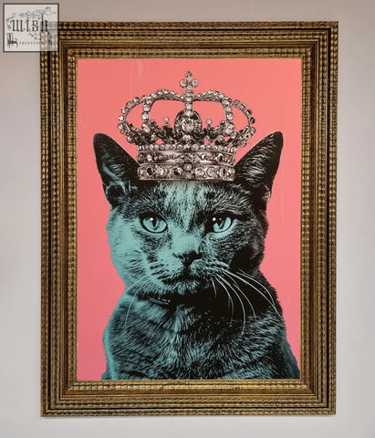 A majesty cat framed print featuring a black cat with teal eyes and a silver crown on a pink background