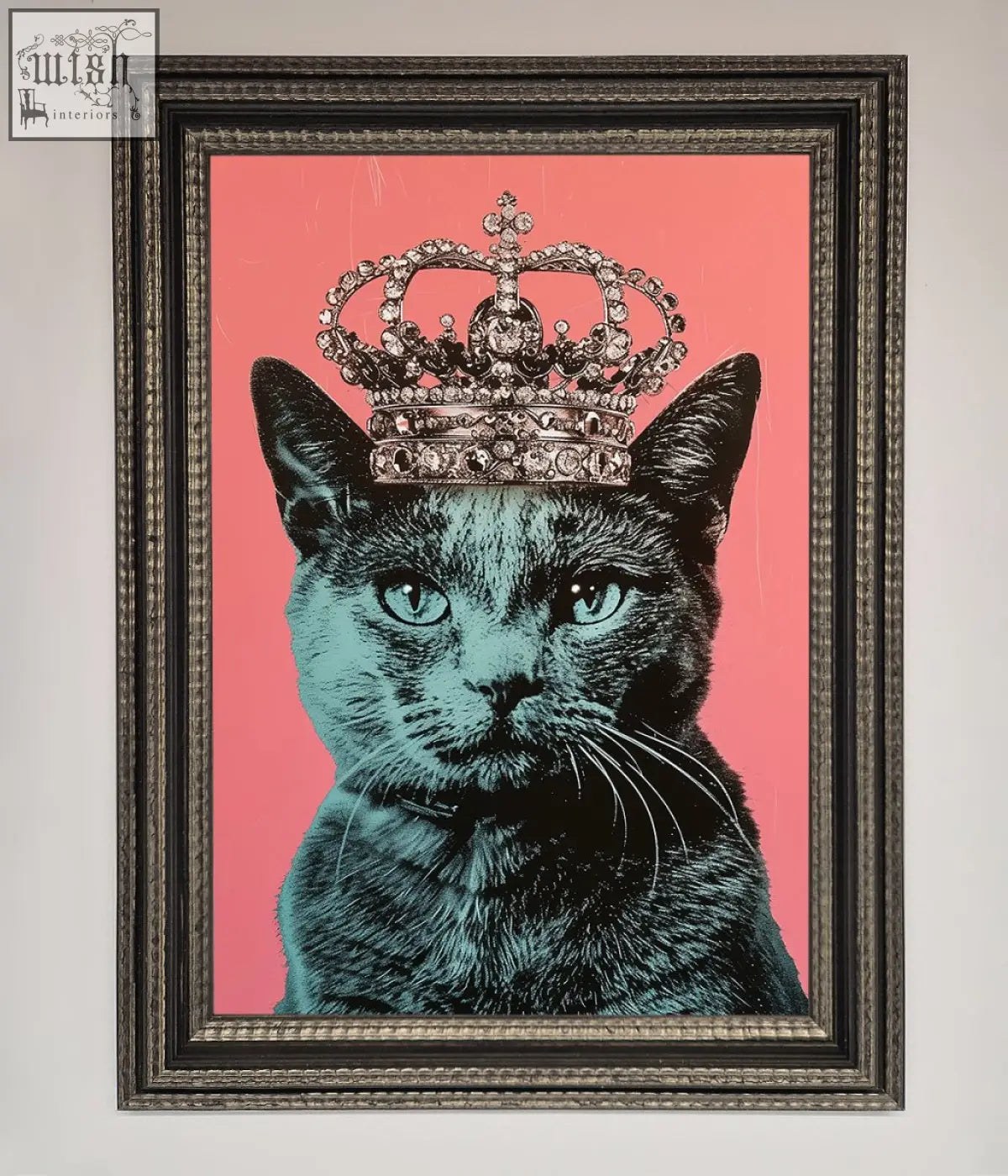A framed print of a majesty cat framed with a black cat wearing a jeweled silver crown on a vibrant pink background