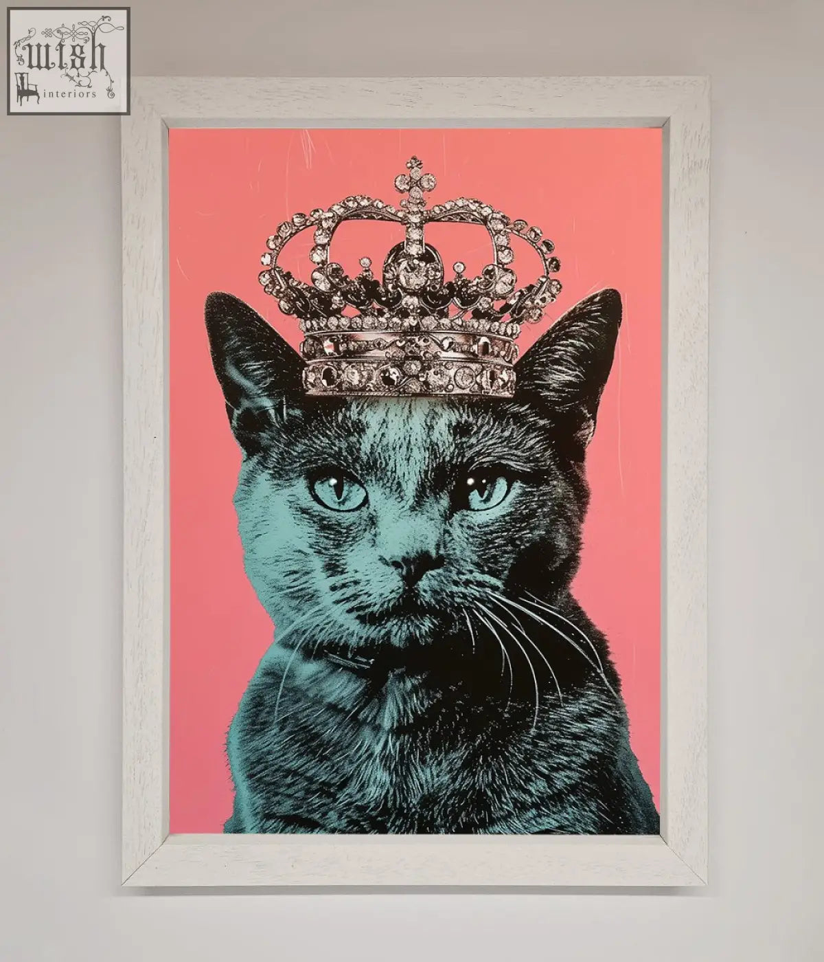 A majesty cat framed print showing a black cat with teal eyes and a silver crown on a vibrant pink background